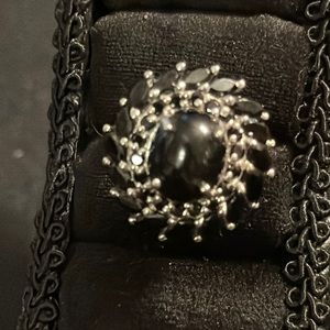 Black Cut Marquee & Round Stones around Center Cabochon Stone